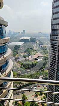 Jakarta business and finance district cityscape with buildings and clouds in sky background