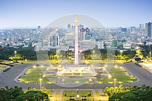 Jakarta city skyline with iconic symbol likes National Monument Monas at night photo