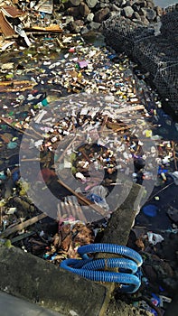 Jakarta, Indonesia - April 2022 : Piles of plastic waste scattered in the sea Jakarta, Indonesia.