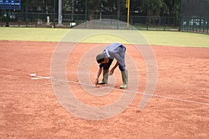 JAKARTA, INDONESIA-NOVEMBER 2, 2018: Worker drawing a line for a