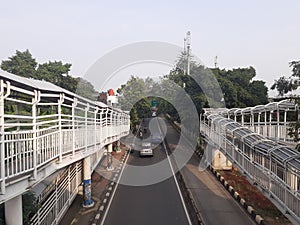 Transjakarta bus stop crossing bridge