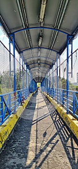 The pedestrian bridge that is above the toll road as a connector for campuses 1 and 2 of Tarumanagara University, Jakarta. photo