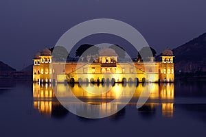 Jal mahal palace on lake at night in India