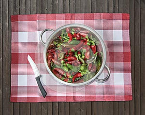 Jalapenos in a metal drip viewed from above