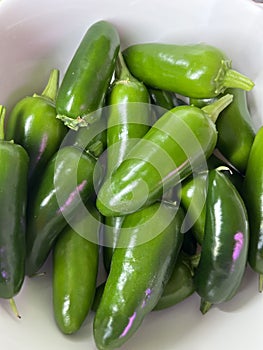 Jalapeño peppers in a white bowl