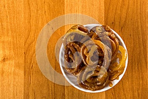 Jalebi Indian sweet dish on a wooden background