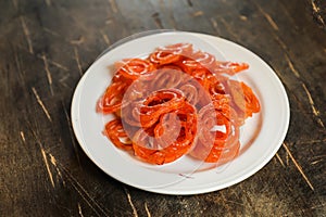 Jalebi or Jilapi served in plate isolated on mat top view of indian, bangali and pakistani dessert mithai