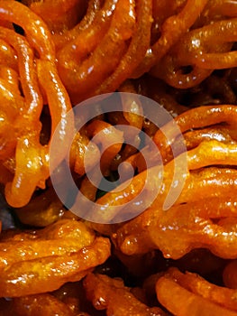 Jalebi is a popular Indian sweet snack in pretzel or circular shapes