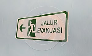 jalur evakuasi (Evacuation Route) sign in green color photo