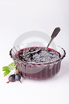 Jam from black gooseberry photo