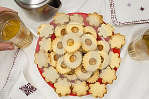 Jam cookies with tea on a table.