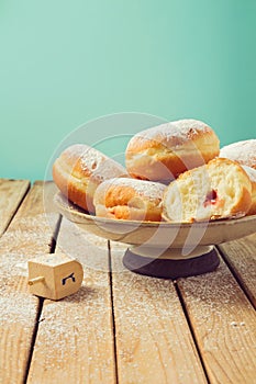 Jam doughnuts with icing sugar for Hanukkah holiday celebration