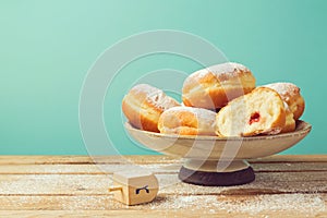 Jam doughnuts with icing sugar for Hanukkah holiday celebration