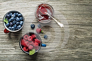 Jam jar with fresh berries