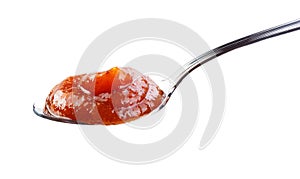 Jam in spoon isolated white background