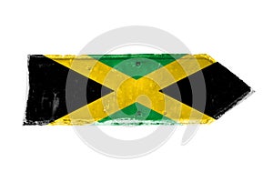 Jamaica flag and colors green, yellow and black over arrow shape from a rusty and grunge metal iron plate