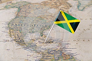 Jamaica flag pin on world map