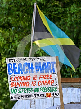 Jamaican flag at a beach market with sign