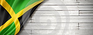 Jamaican flag on old white wall banner photo