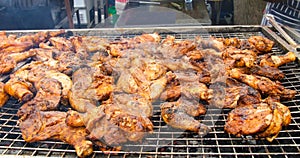 Jamaican jerk chicken on charcoal grill photo