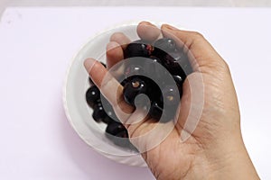 Jambolan plum or Java plum juice isolated on white background