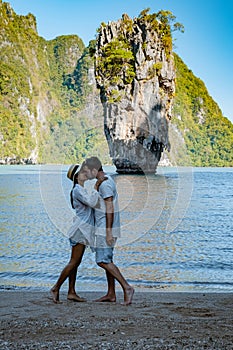 James Bond island near Phuket in Thailand. Famous landmark and famous travel destination, couple men and woman mid age