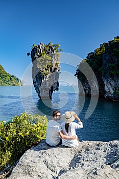 James Bond island near Phuket in Thailand. Famous landmark and famous travel destination, couple men and woman mid age