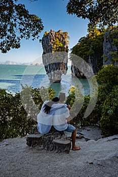 James Bond island near Phuket in Thailand. Famous landmark and famous travel destination, couple men and woman mid age