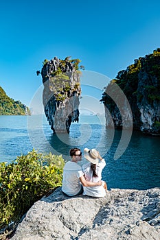 James Bond island near Phuket in Thailand. Famous landmark and famous travel destination, couple men and woman mid age