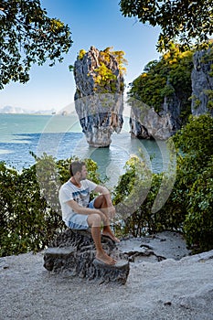 James Bond island near Phuket in Thailand. Famous landmark and famous travel destination, men mid age visititng James