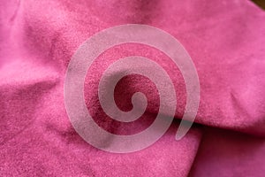 Jammed bright cerise-colored faux suede fabric