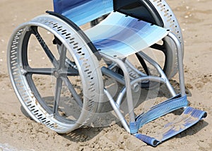 jammed wheelchair on the sand photo