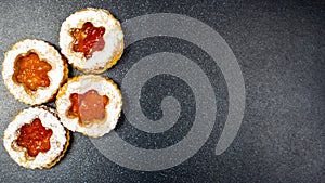 Jammy dodger, occhi di bue, cookies with jam and powdered sugar photo