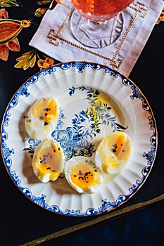 jammy soft boiled eggs on plate, table