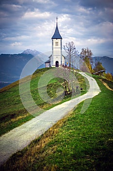 Jamnik, Slovenia - The beautiful church of St. Primoz in Slovenia near Jamnik with Julian Alps