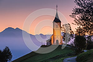 Jamnik, Slovenia, church of St. Primoz, Julian Alps at background