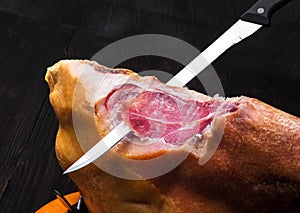 Jamon. Jamon serrano. Traditional Spanish ham on black close up.