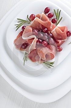 Jamon serrano with rosemary and grape .