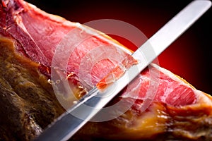 Jamon serrano. Slicing hamon iberico