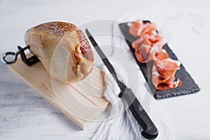 Jamon serrano. Traditional Spanish ham, Slicing of dry-cured ham in Spain