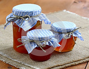 Jams and jellies in glass jars photo