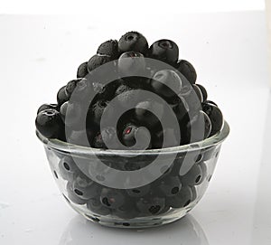 Jamun fruits in glass bowl in white background