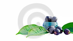 Jamun or Syzygium Cumini in a Ceramic Bowl with Leaves Isolated on White Background with Copy Space, Also Known as Java Plum,