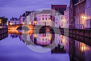 Jan van Eyckplein, old town of Bruges, Belgium during sunset.