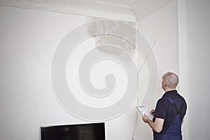 janitor caretaker water stain cracks wall