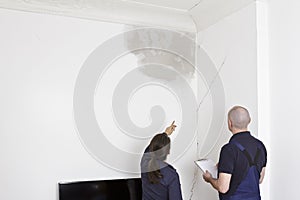 janitor caretaker water stain cracks wall