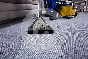 Janitor Cleaning Carpet photo