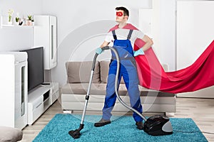 Janitor Cleaning Carpet With Vacuum Cleaner