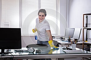 Janitor Cleaning Desk With Rag
