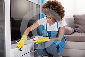 Janitor Cleaning Furniture With Sponge